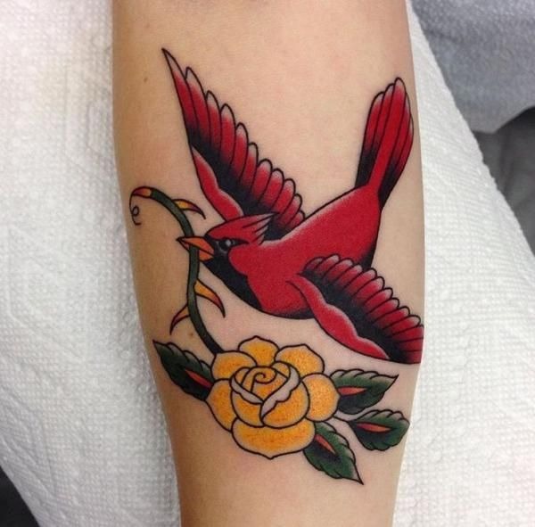 Traditional Flying Cardinal with a Golden Rose Tattoo Design