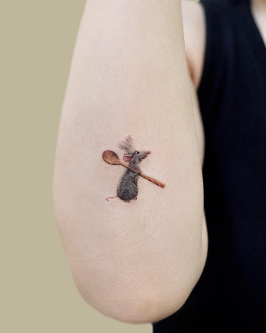 Charming cartoon mouse tattoo with a spoon Tattoo Design