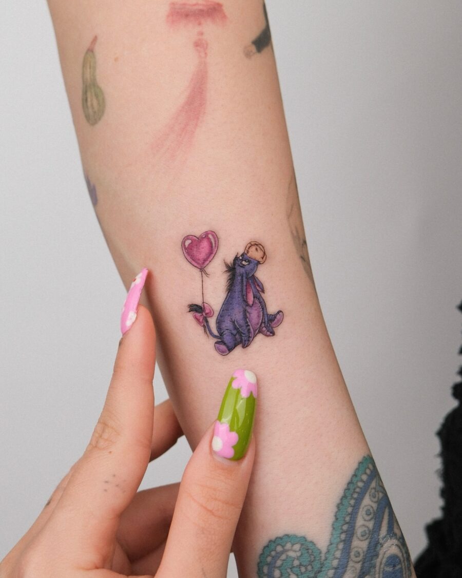Charming Eeyore Tattoo with a Heart Balloon Tattoo Design