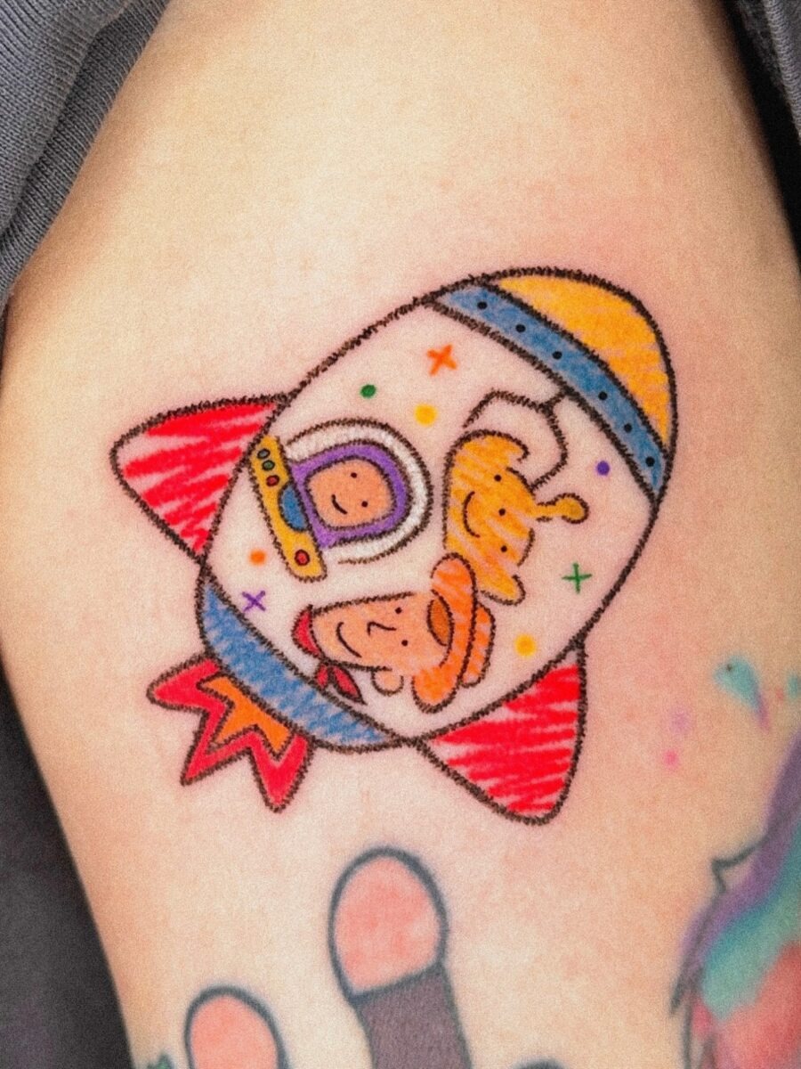 Playful Cartoon Astronaut Rocket Design Tattoo Tattoo Design