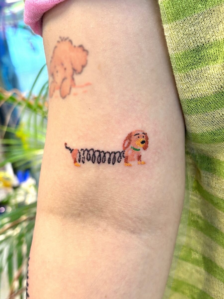 Quirky Cartoon Dog Tattoo with Fun Vibes Tattoo Design