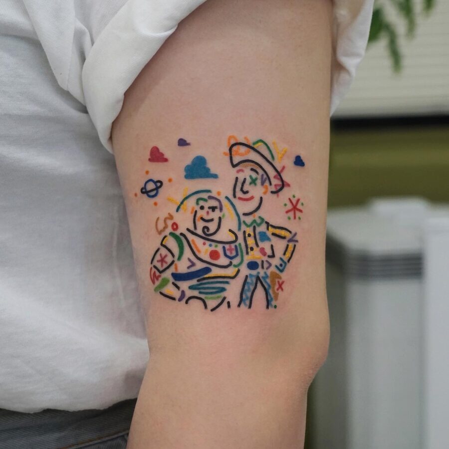 Whimsical Buzz and Woody cartoon tattoo art Tattoo Design