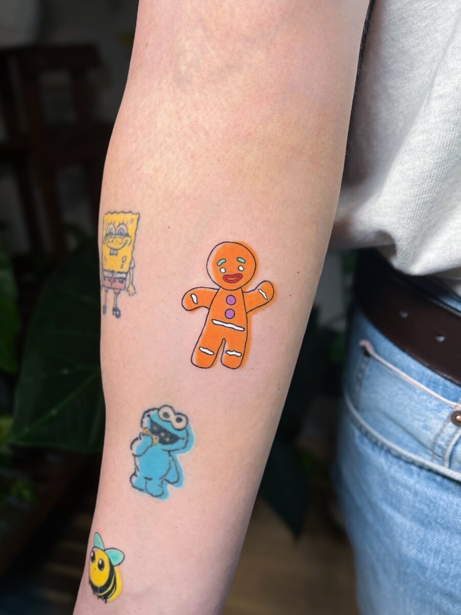 Whimsical cartoon tattoos for playful vibes Tattoo Design