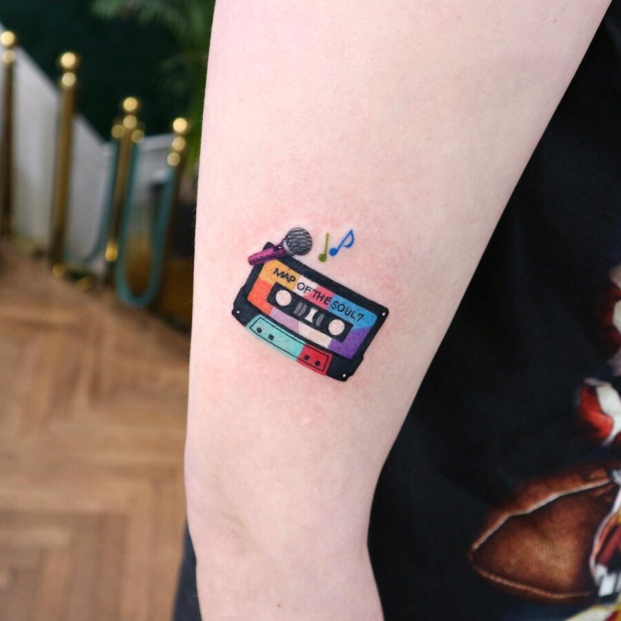 This tattoo features a cassette tape with the words 'Map of the Soul?' prominently displayed.