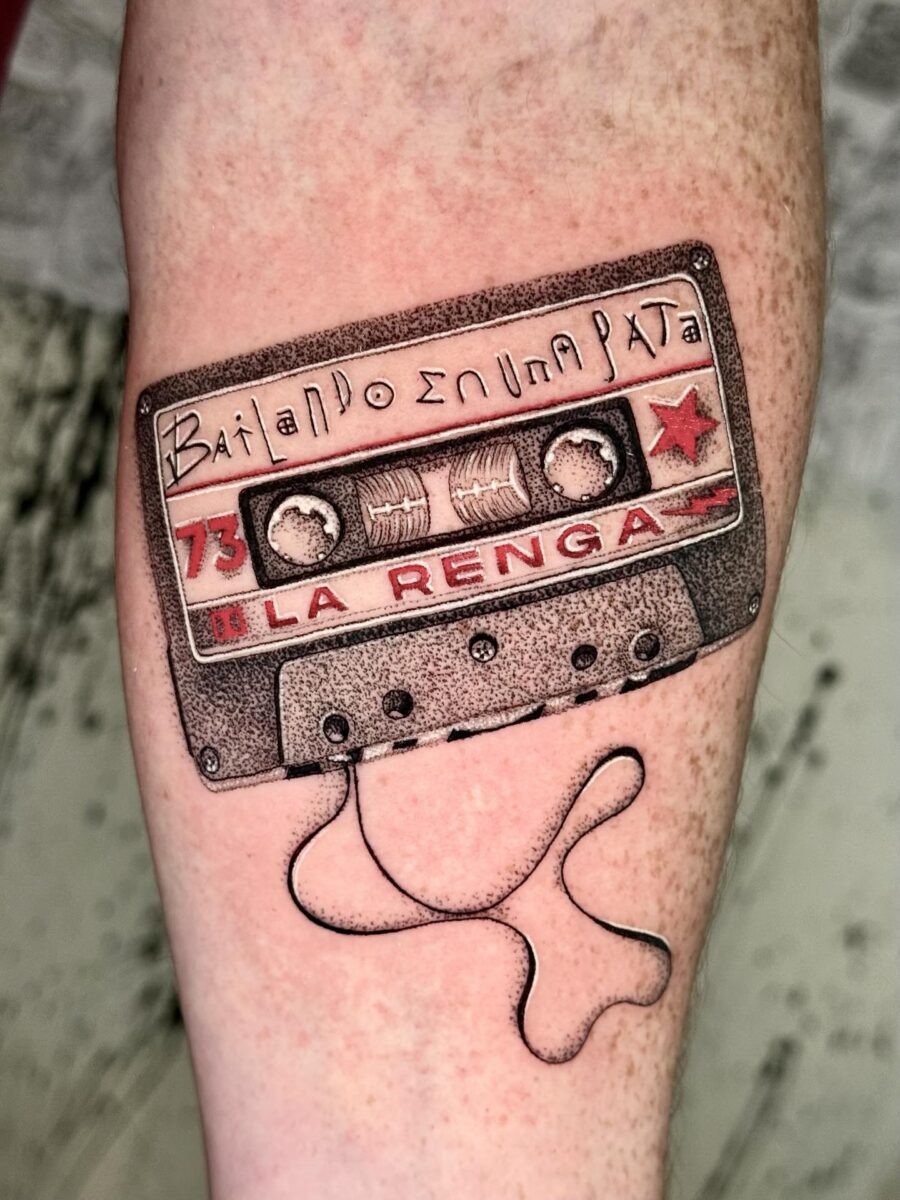 This tattoo features a classic cassette tape design, complete with intricate details.