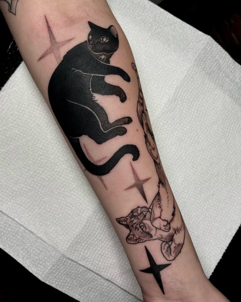 Contrasting Cats and Celestial Stars Tattoo Design