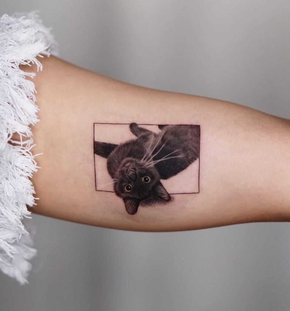 Playful Black Cat in a Frame Tattoo Design