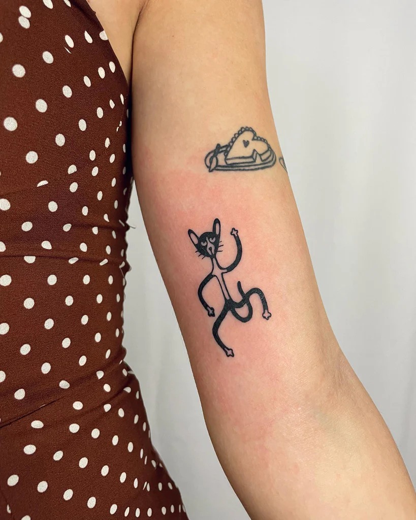 Playful Cat with Starry Limbs Tattoo - A Quirky and Minimalistic Design Tattoo Design