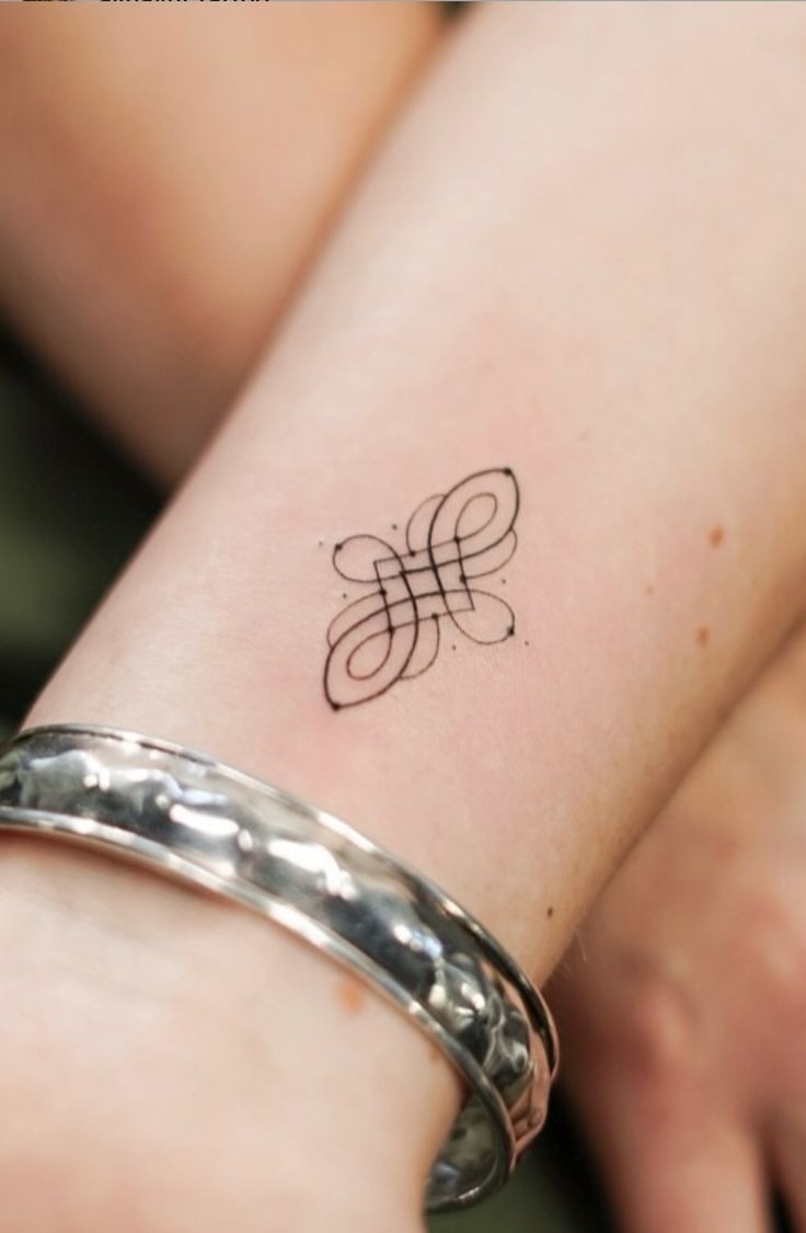Trinity Knot With Memorial Dates Tattoo Design