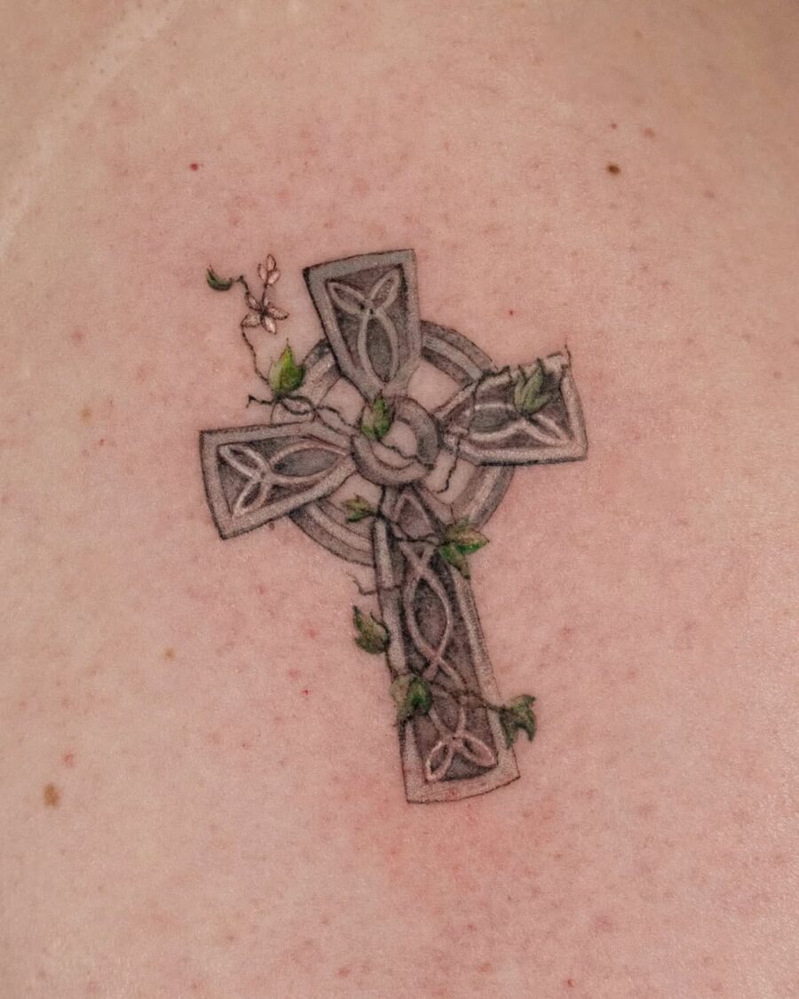 Intricate Celtic cross with nature elements Tattoo Design