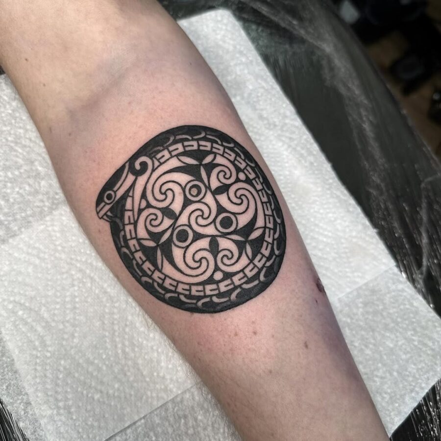 Intricate Celtic snake tattoo in circular design Tattoo Design