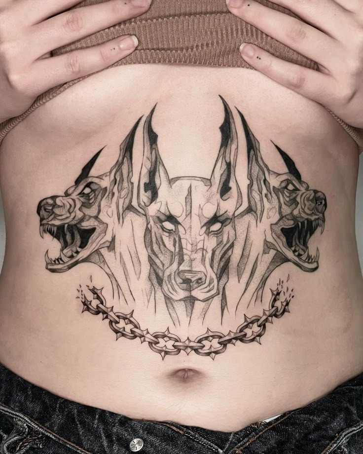 Detailed Cerberus Chest Crest Tattoo Design