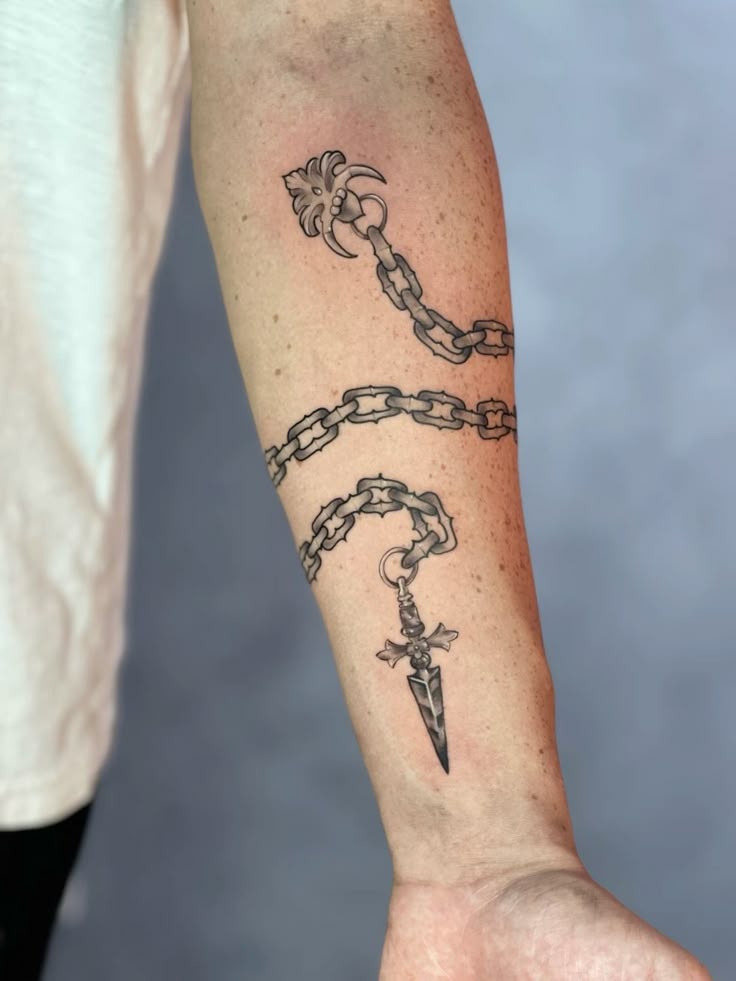 Flowing Chain with Dagger Drop Tattoo Design