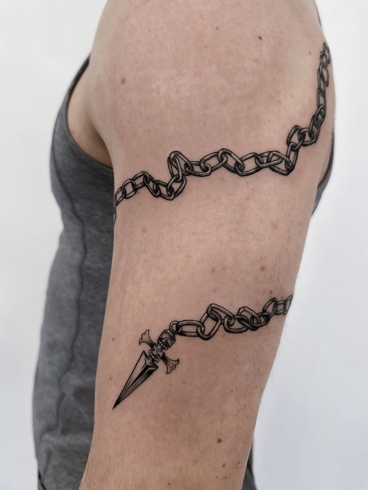 Minimal Chain Band with Dagger Accent Tattoo Design