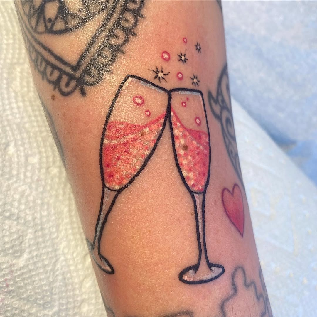 Celebratory champagne glasses with sparkles Tattoo Design