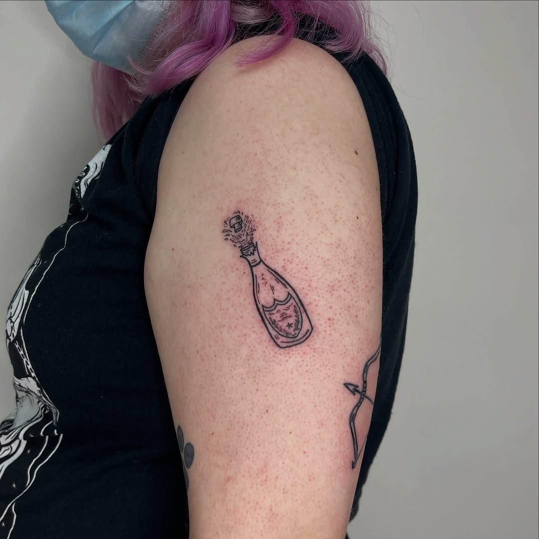 Charming champagne bottle tattoo design. Tattoo Design