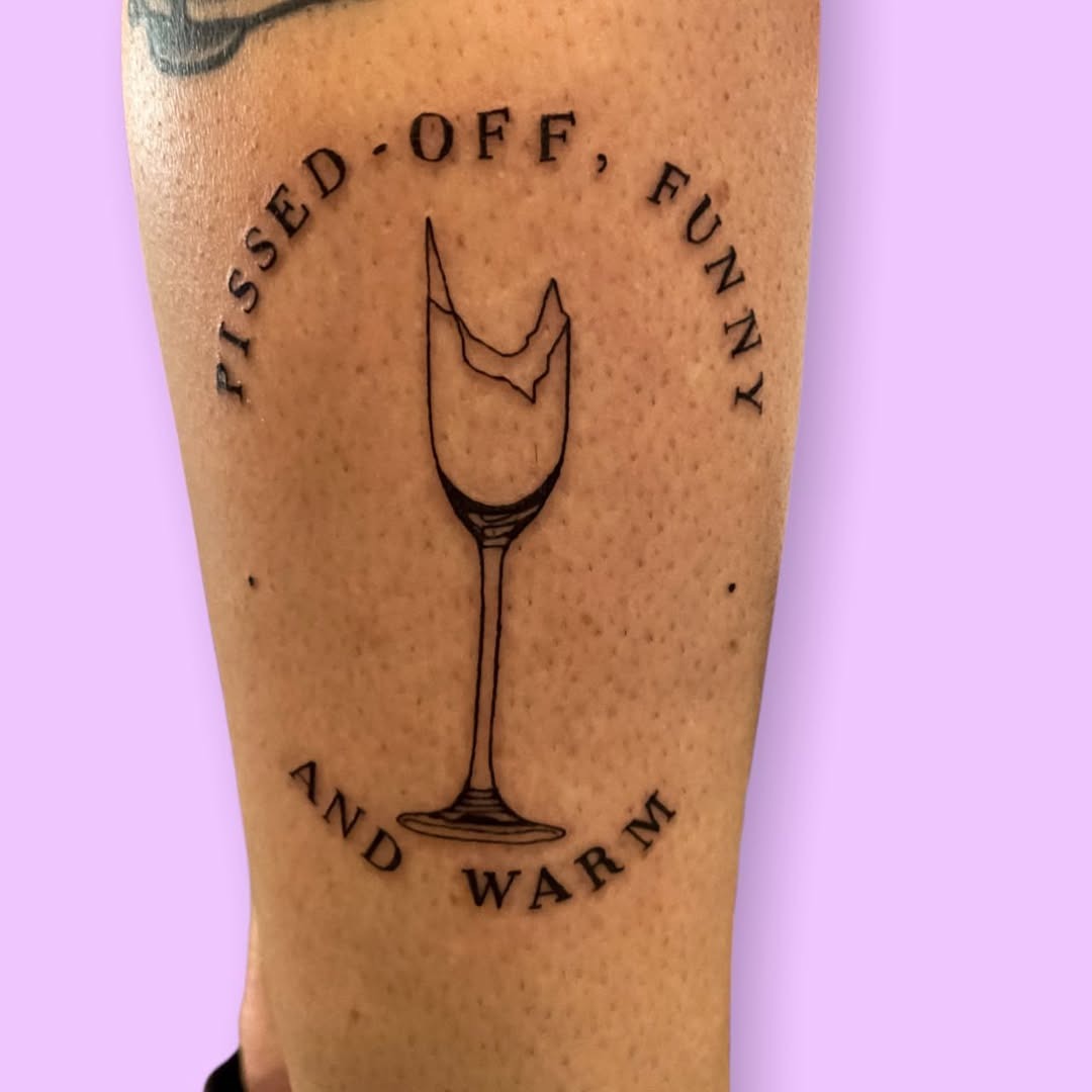 Charming champagne glass tattoo with a twist Tattoo Design