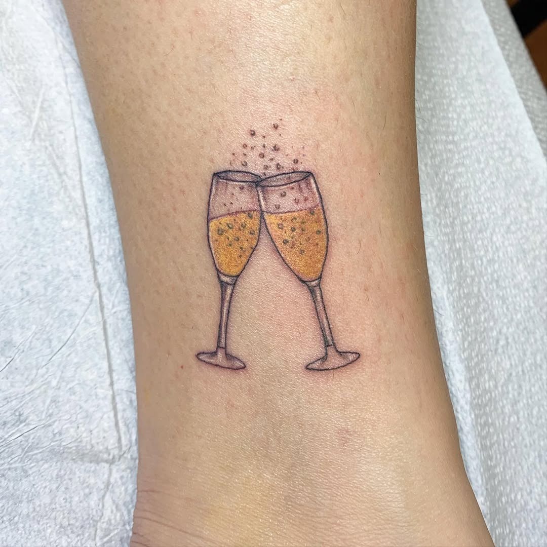 Charming champagne tattoo celebrating friendships Tattoo Design