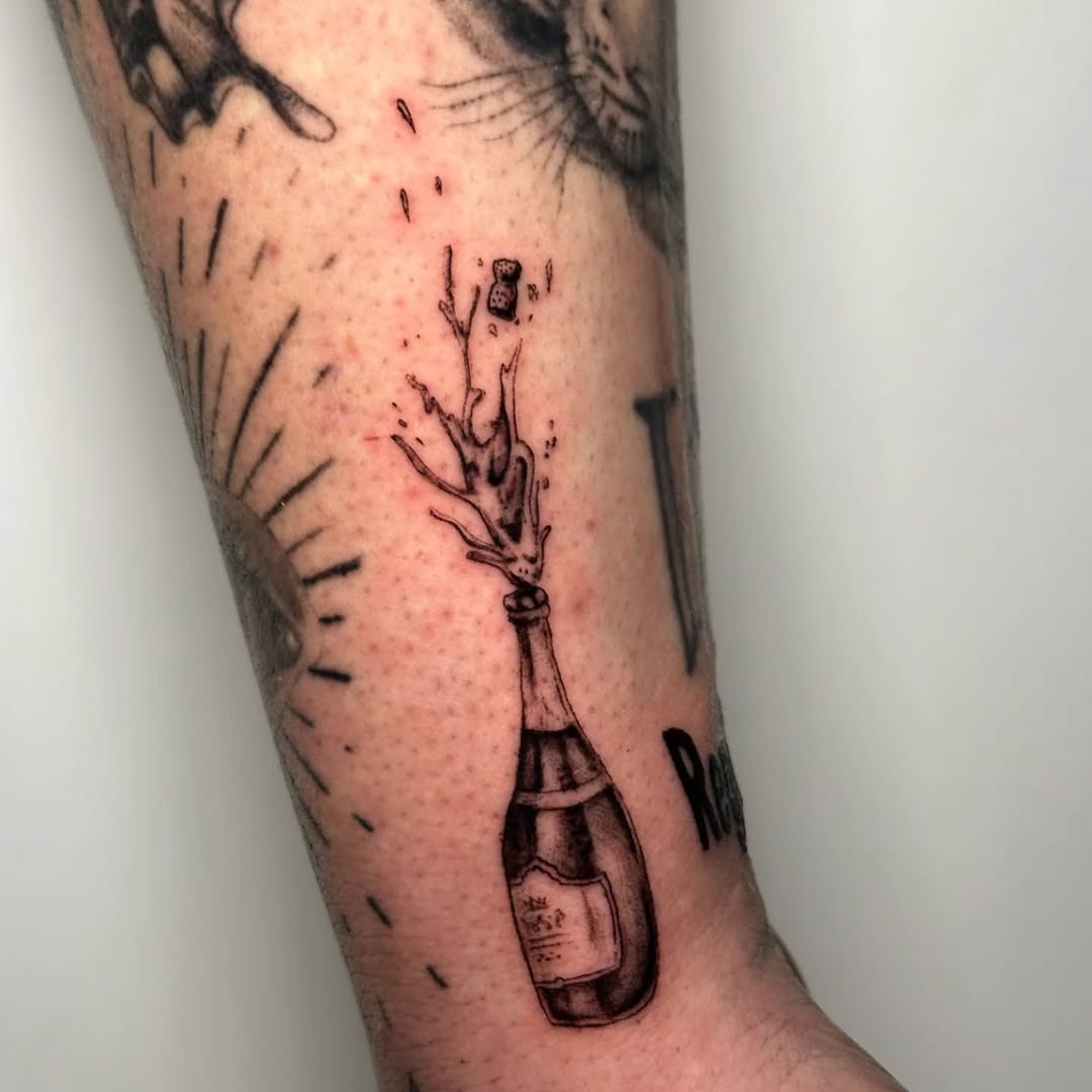 Expressive champagne tattoo with playful vibes Tattoo Design