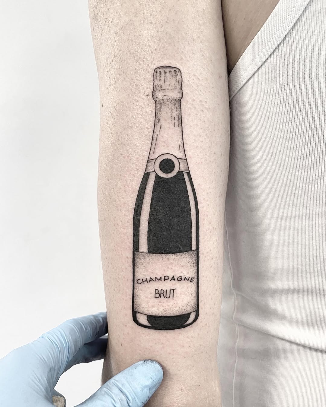 Stylish champagne bottle tattoo in black and white Tattoo Design