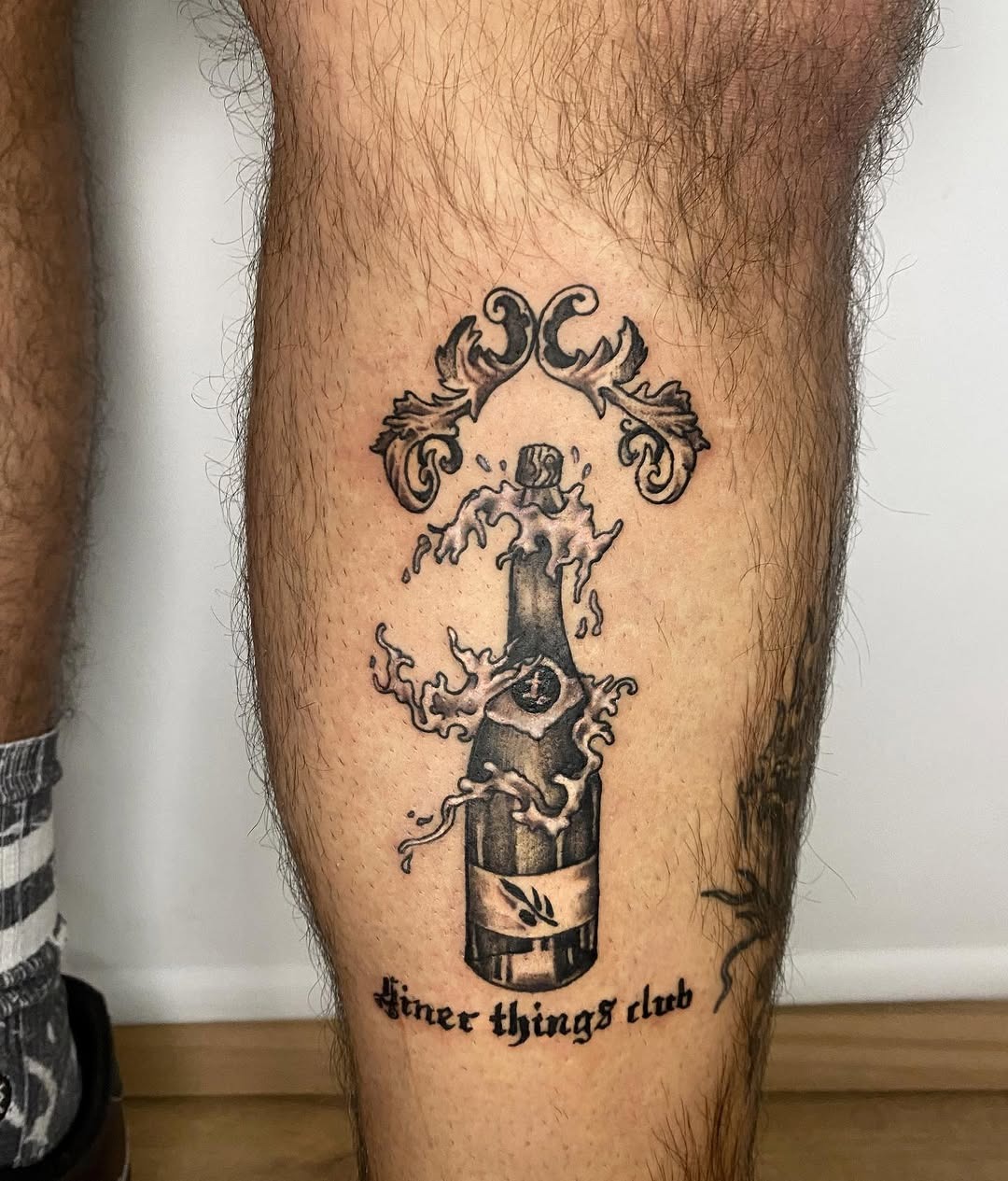 Stylish champagne tattoo with elegant detailing Tattoo Design