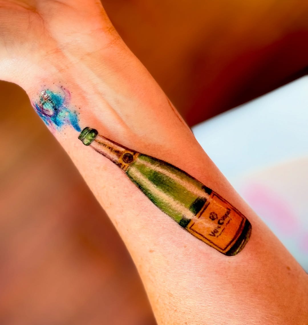 Vibrant champagne bottle tattoo celebrating life. Tattoo Design