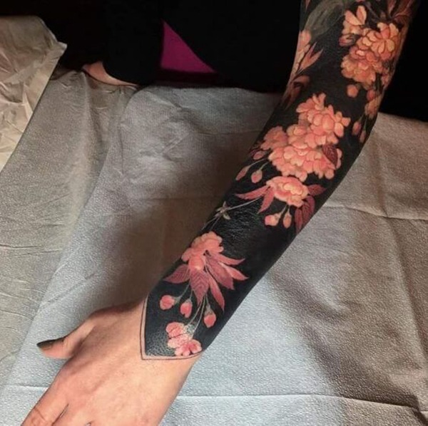 The Flowers Against a Black Backdrop Tattoo Design