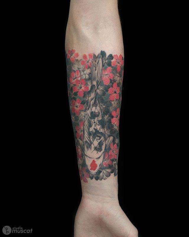 The Koi Fish Swimming Through Flowers Tattoo Design