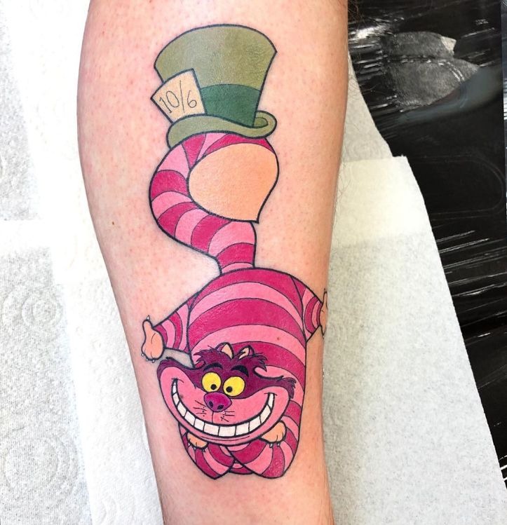 Cartoon-Style Cheshire Cat With Hat Tattoo Tattoo Design