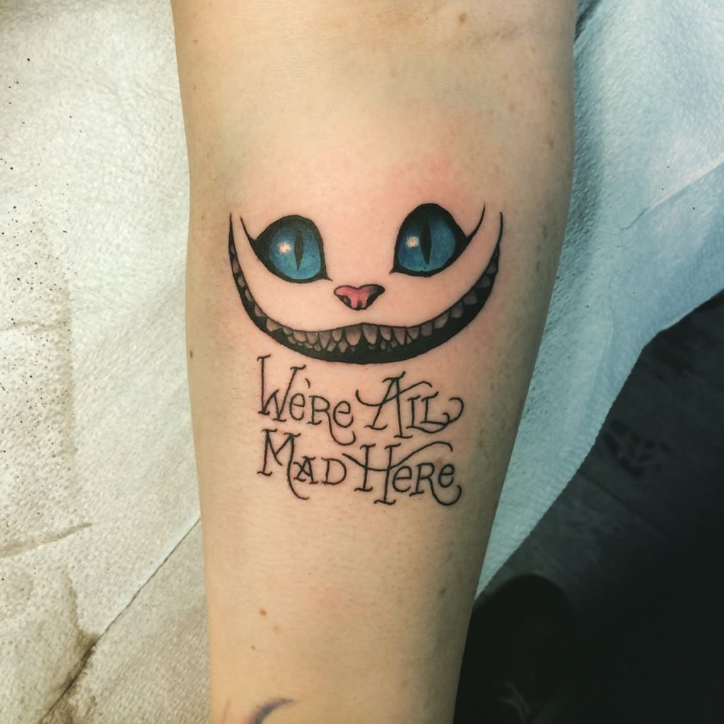Classic “We’re All Mad Here” Cheshire Cat Tattoo Tattoo Design