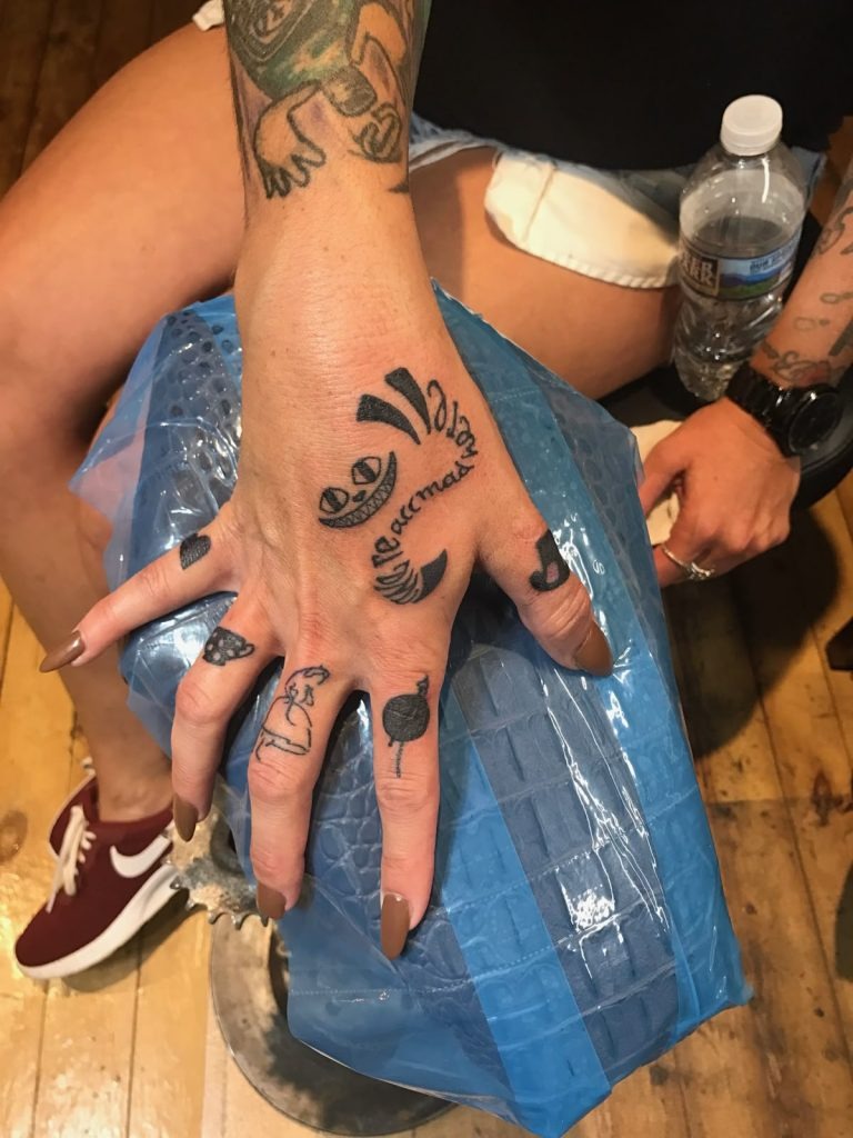 Minimalist Cheshire Cat Finger Tattoo Tattoo Design
