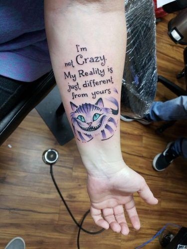 Purple-Striped Cheshire Cat With Quote Tattoo Tattoo Design