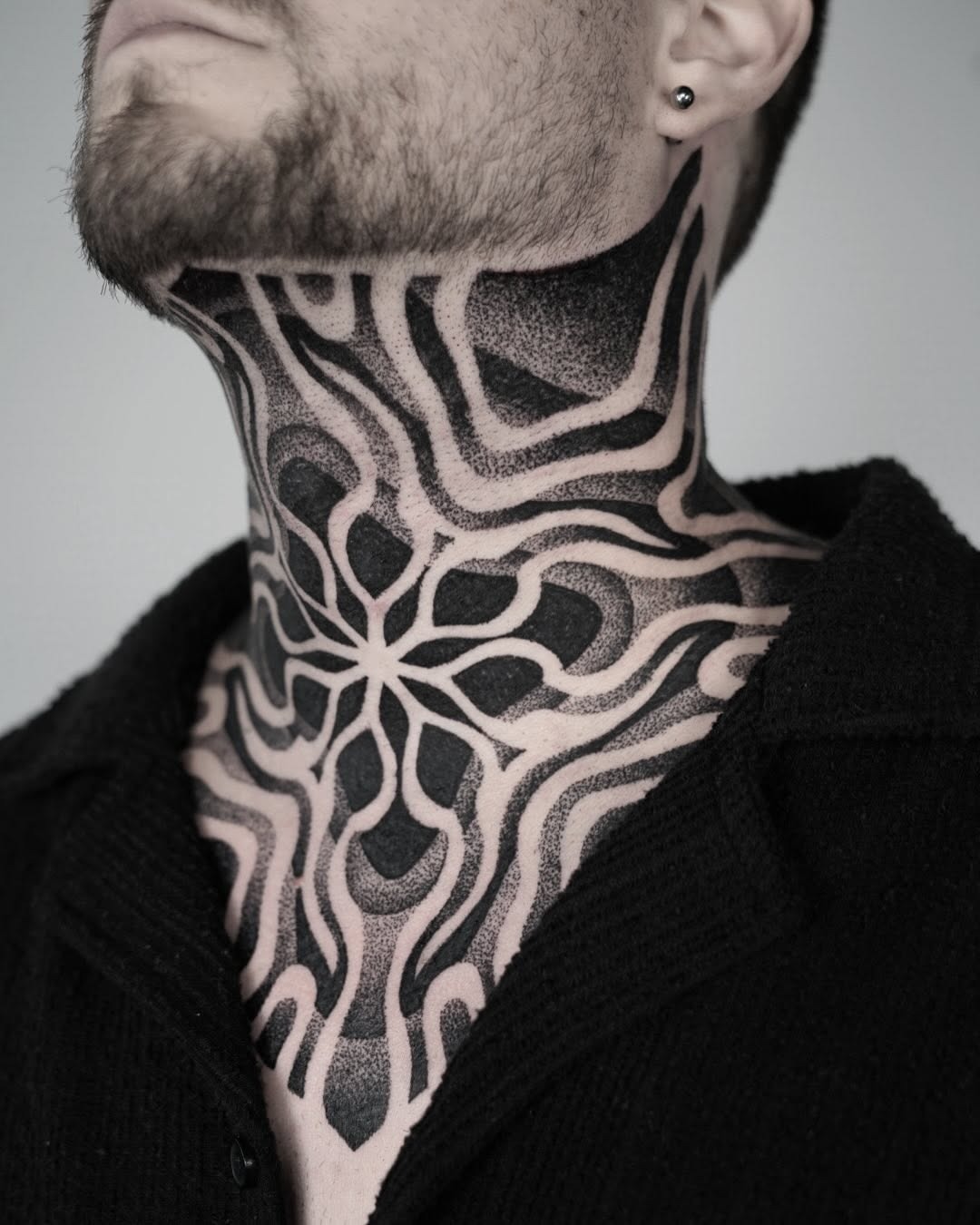 Artful black neck and chest tattoo design Tattoo Design