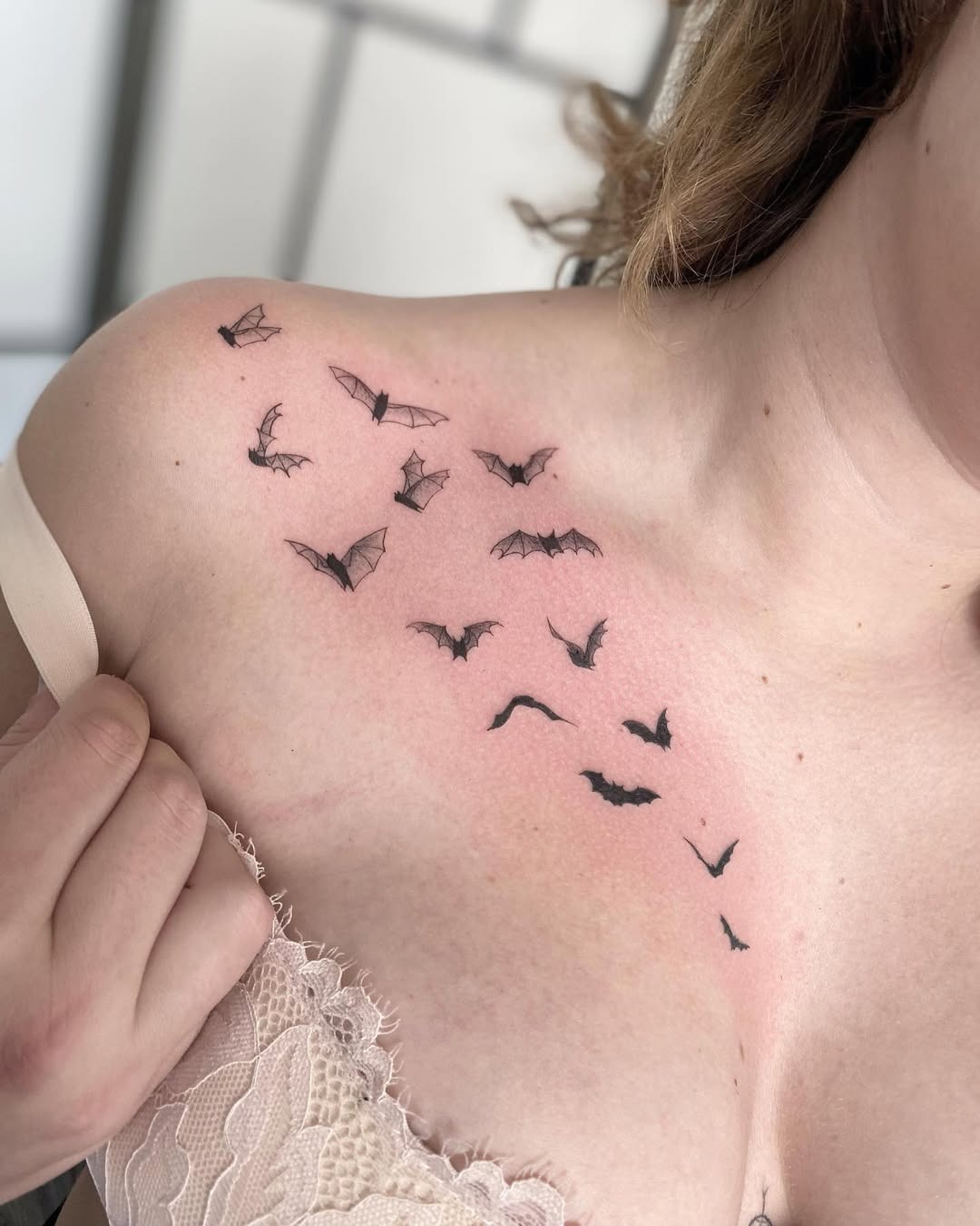 Elegant bats accentuating the collarbone area Tattoo Design