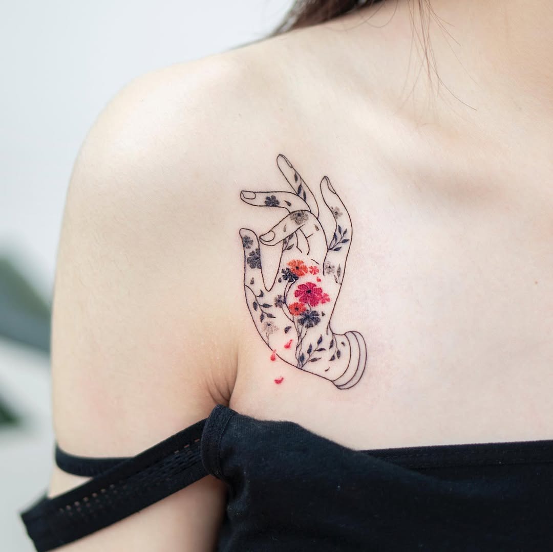 Feminine Floral Hand Tattoo with Vibrant Colors Tattoo Design