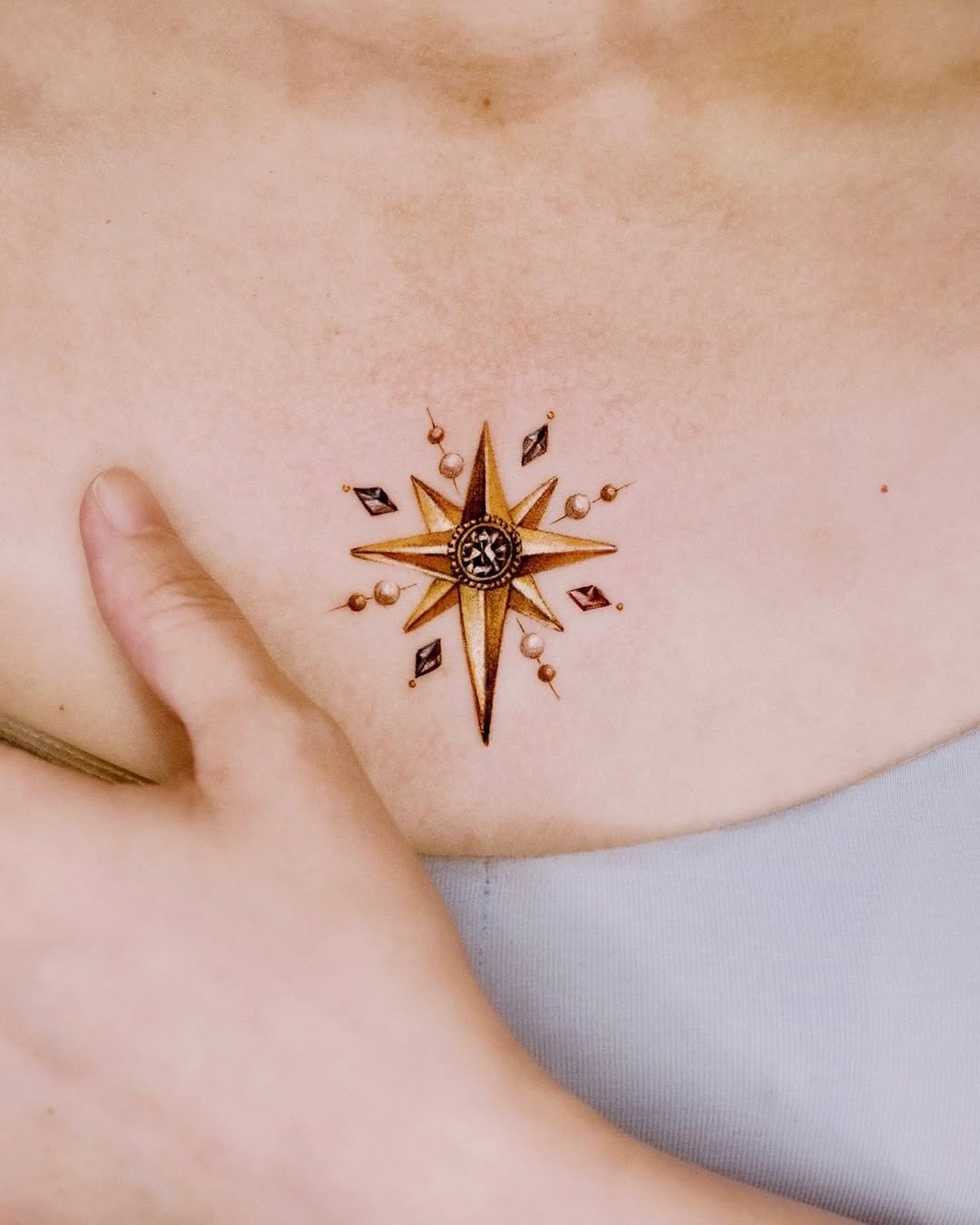 Intricate compass rose chest tattoo design Tattoo Design