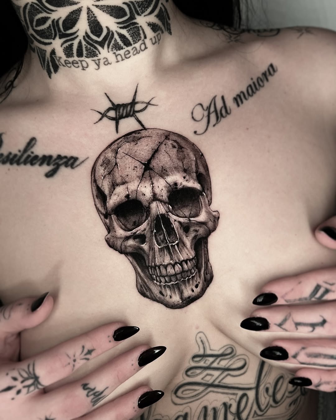 Intricate skull tattoo sits boldly on chest Tattoo Design