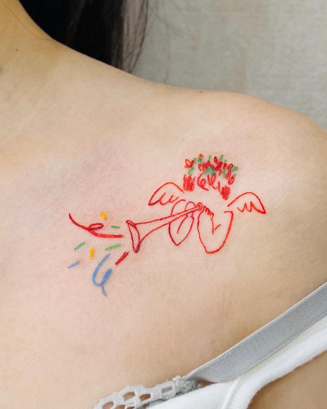 Whimsical angel tattoo on the chest Tattoo Design