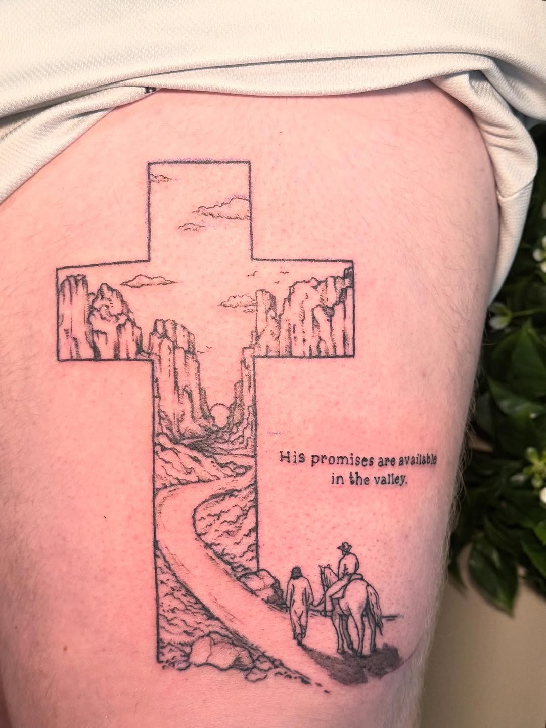 A Serene Cross Tattoo with a Scenic Journey Tattoo Design