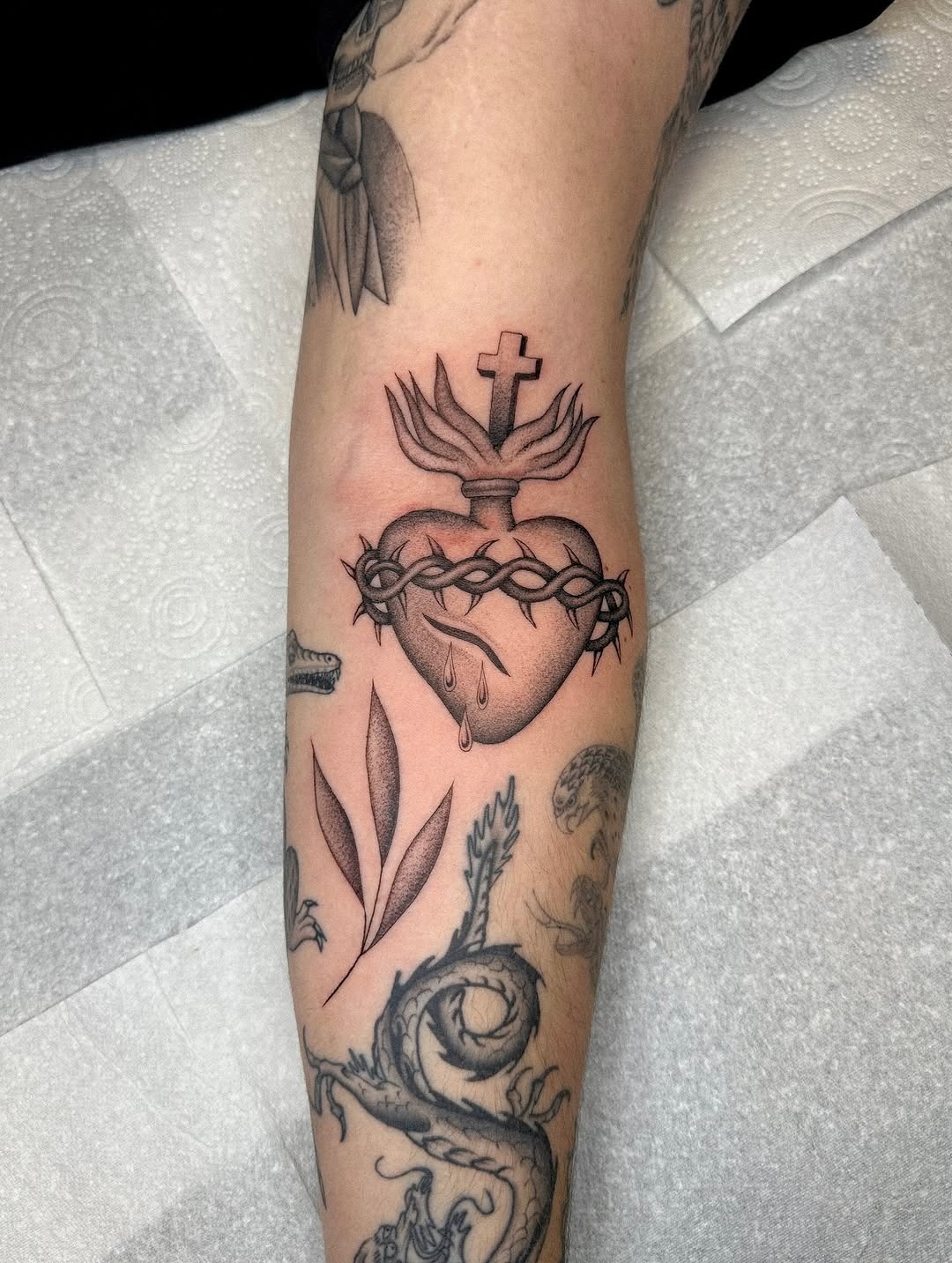 Elegant faith-inspired heart and cross tattoo Tattoo Design