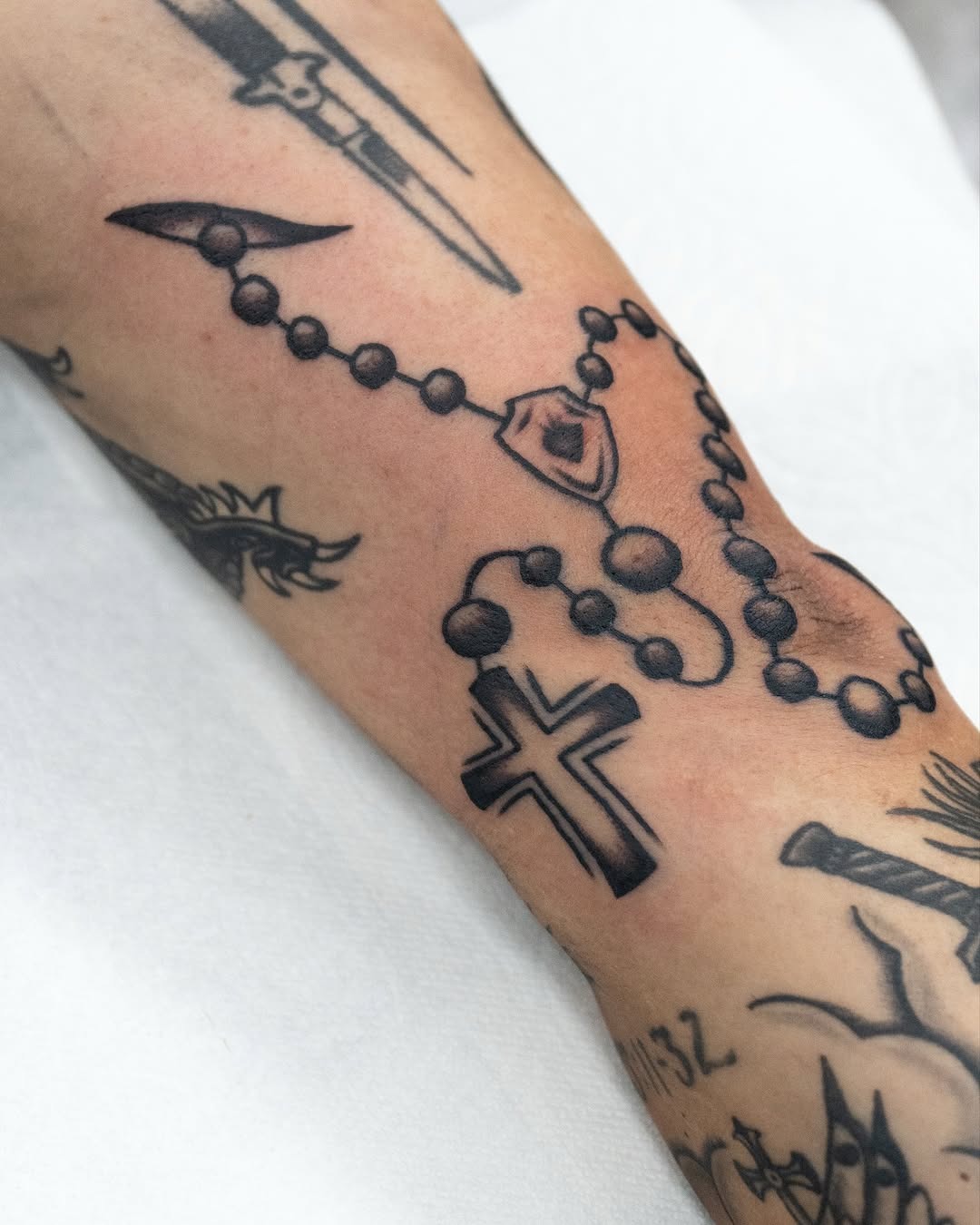 Elegant Rosary Tattoo with Cross Design Tattoo Design