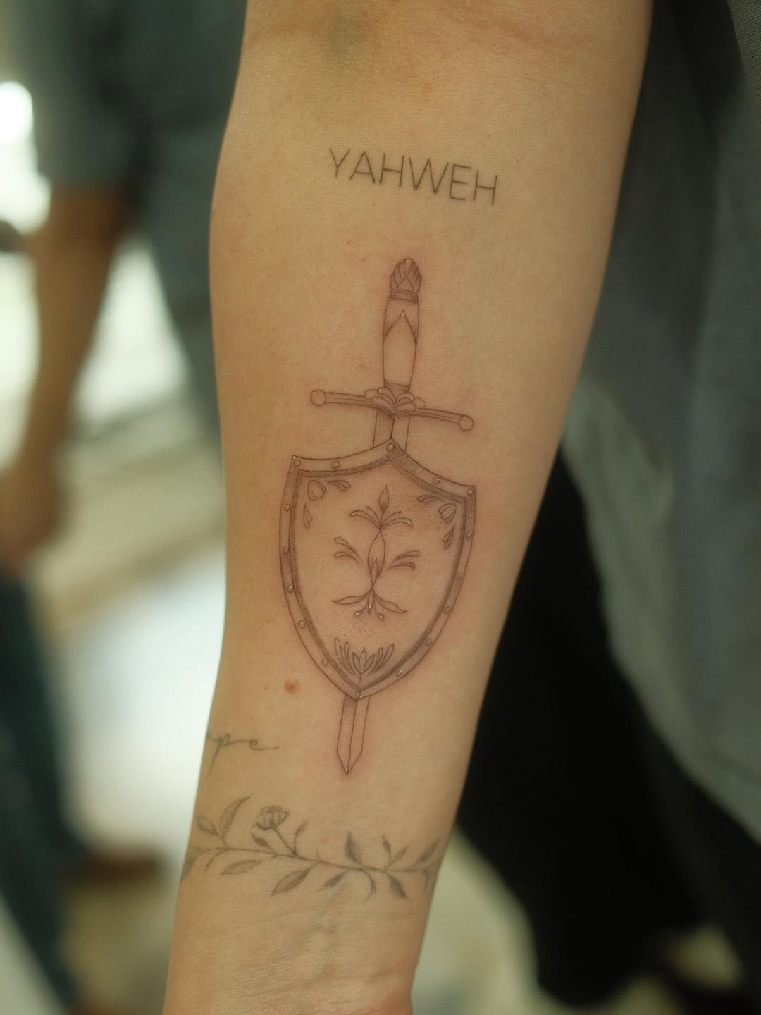 Faith-Inspired Shield Tattoo with Yahweh Tattoo Design