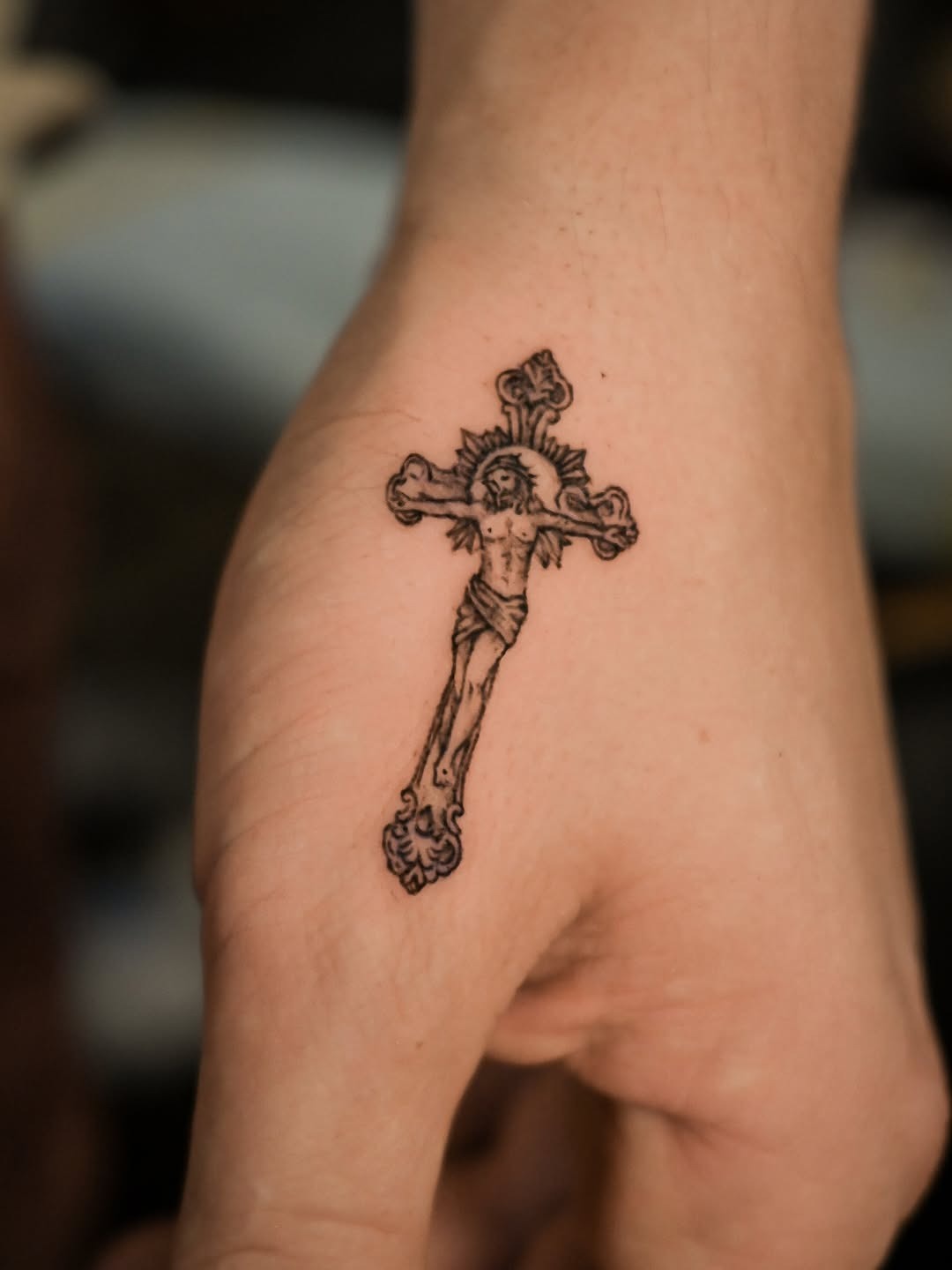 Intricate Christian cross tattoo on palm. Tattoo Design
