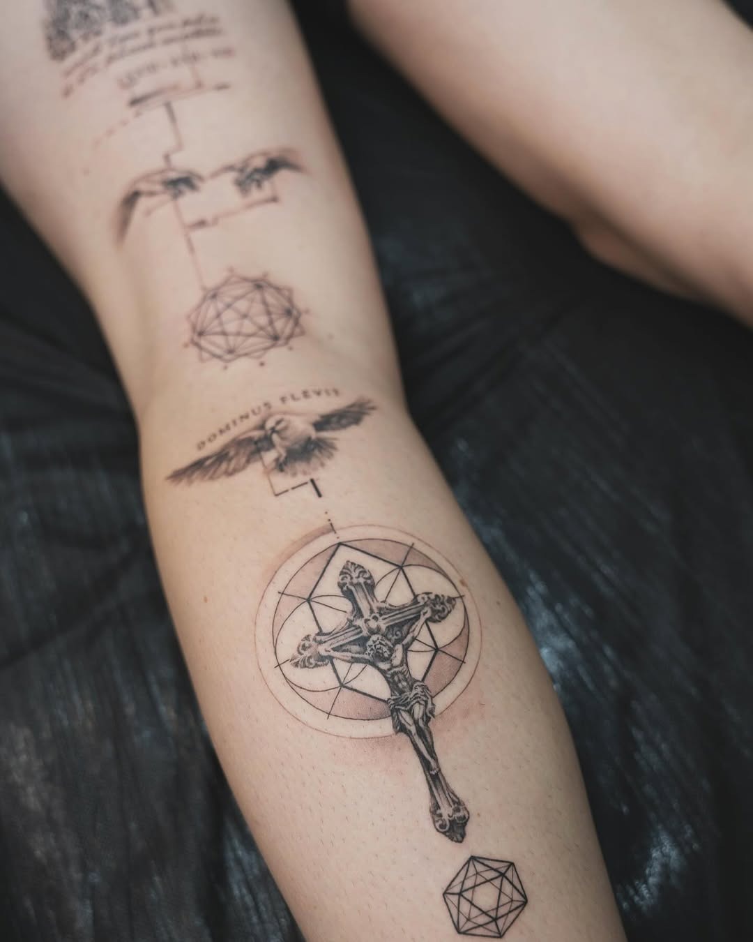 Intricate Cross Surrounded by Mystical Symbols Tattoo Design