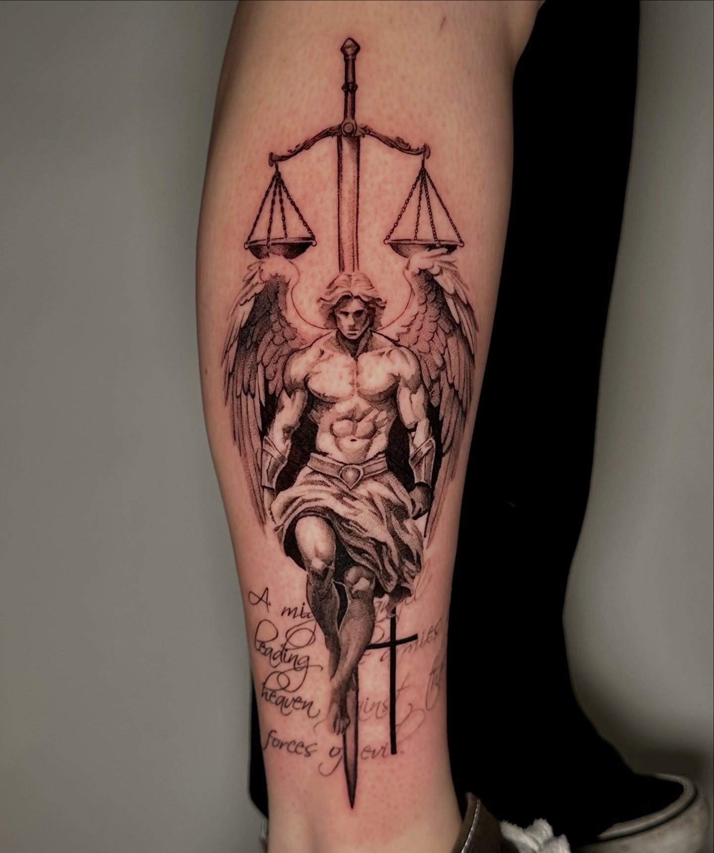 Powerful angel tattoo symbolizing justice and faith Tattoo Design