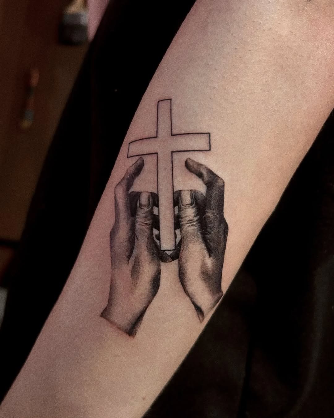 Symbolic hands embracing a cross design Tattoo Design