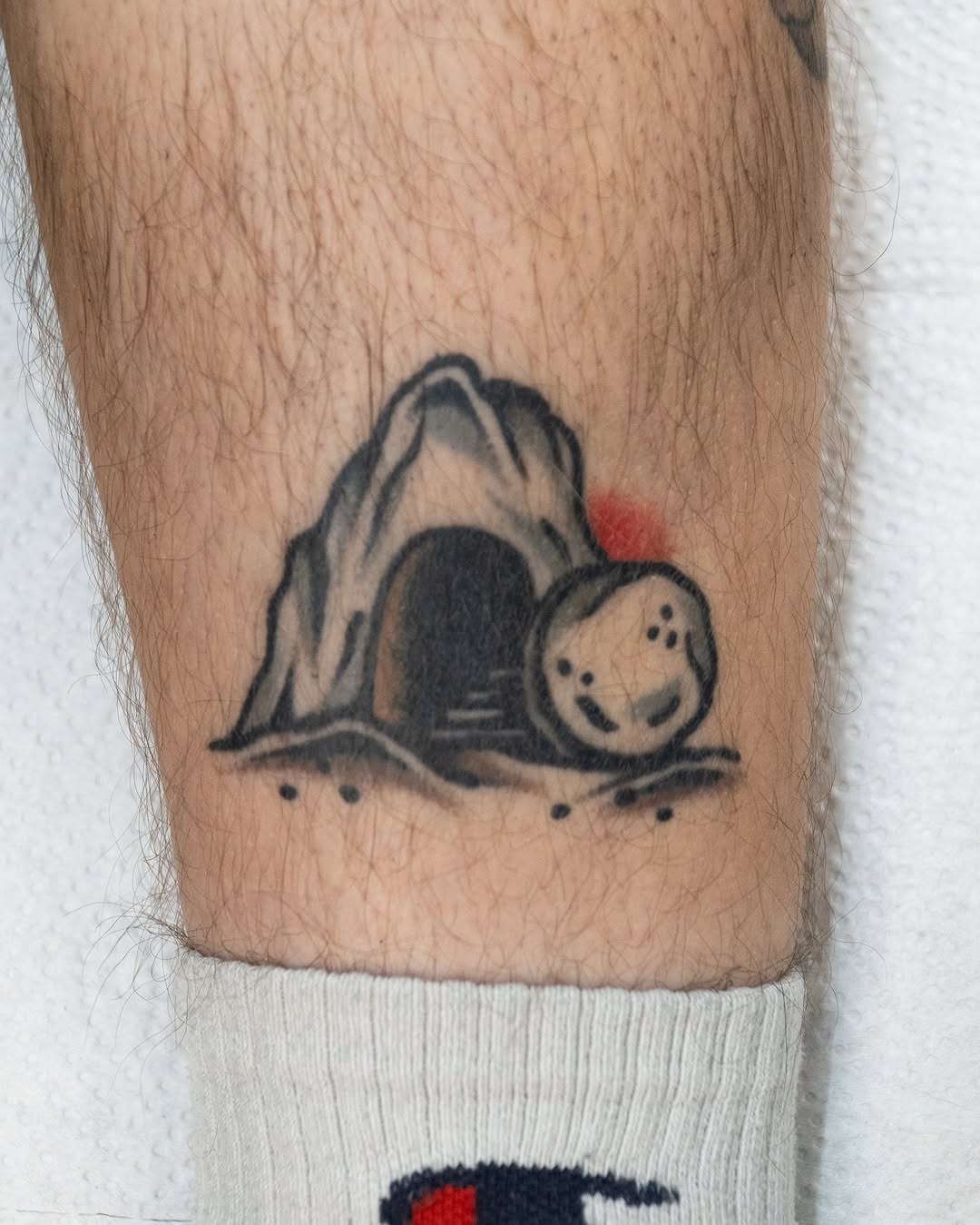 Symbolic resurrection cave tattoo with stone Tattoo Design