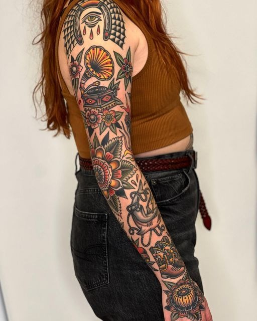 Sunflower and Symbol-Filled Color Sleeve Tattoo Design