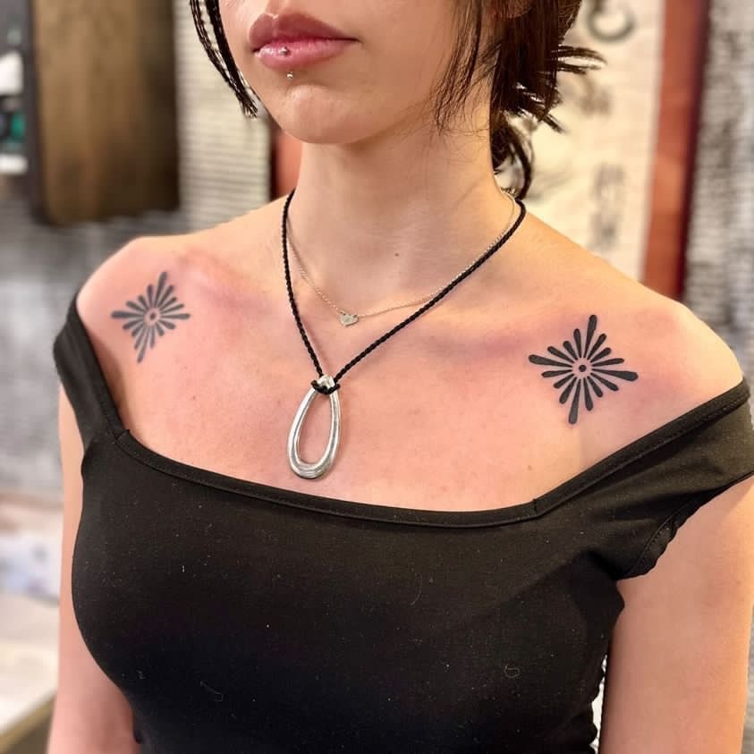 Bold Daisy Starburst Pair Tattoo Design