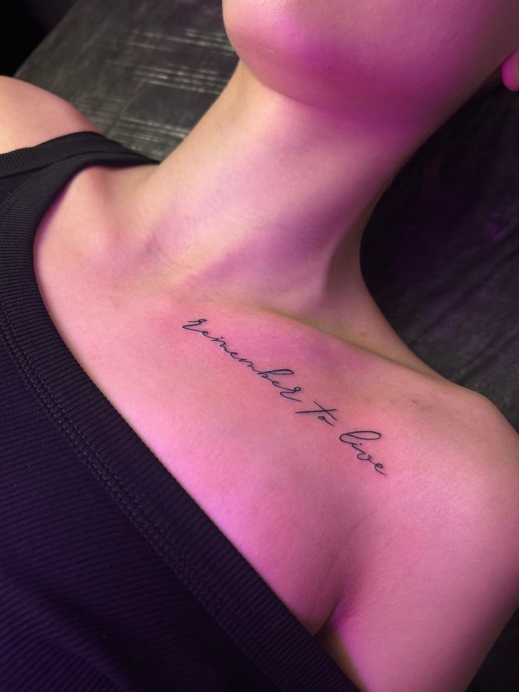 Delicate Script Quote Along the Collarbone Tattoo Design